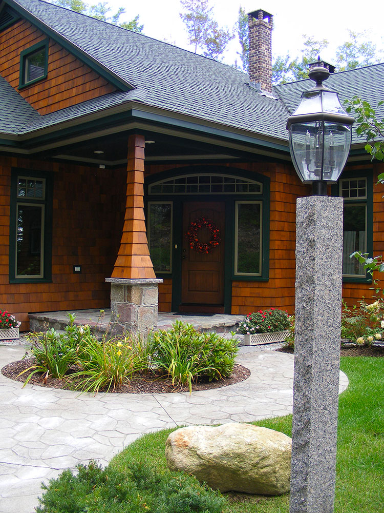 CALENDONIA™ granite lamp post and stamped concrete walkway